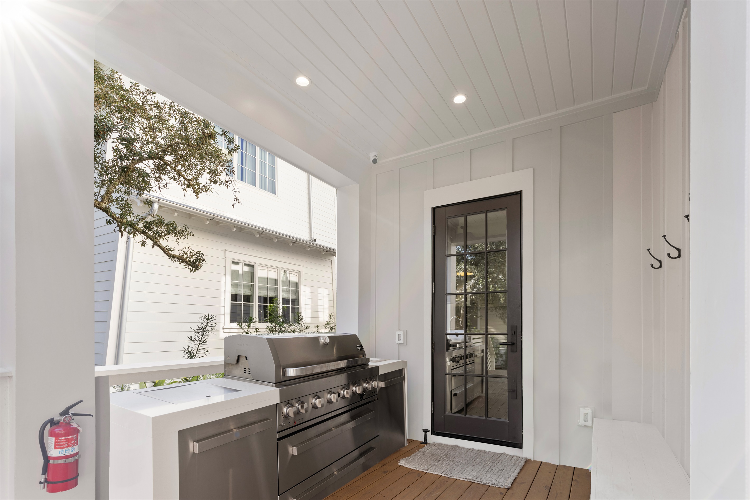 Outdoor Kitchen + Entry to Laundry Room/Mud Room