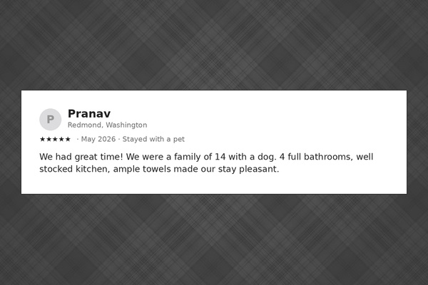 Fourteen guests, four bathrooms, one well-stocked kitchen — guests say it makes a big group easy.