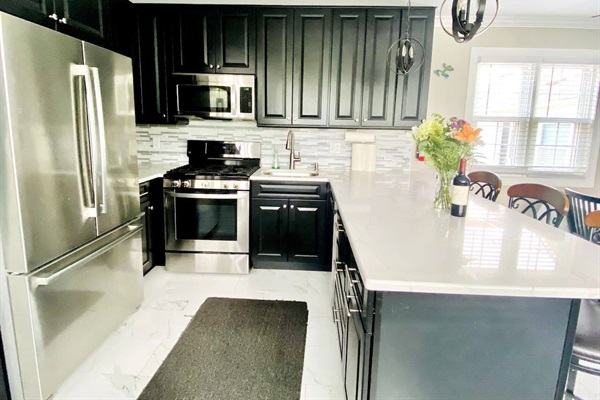 kitchen with high end appliances. Complete Silver ware, Dishes, utensils, pots and pans included.