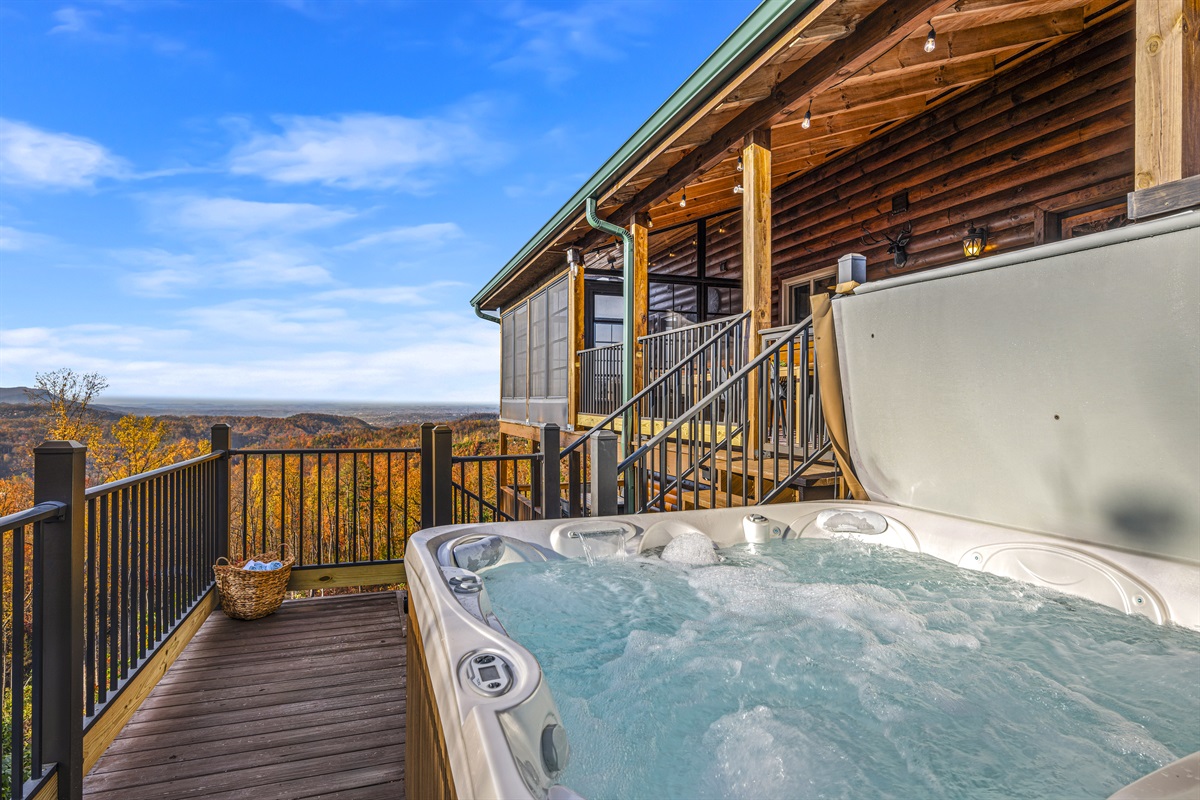 Soak in the hot tub at Signature Stay, where relaxation meets breathtaking mountain views