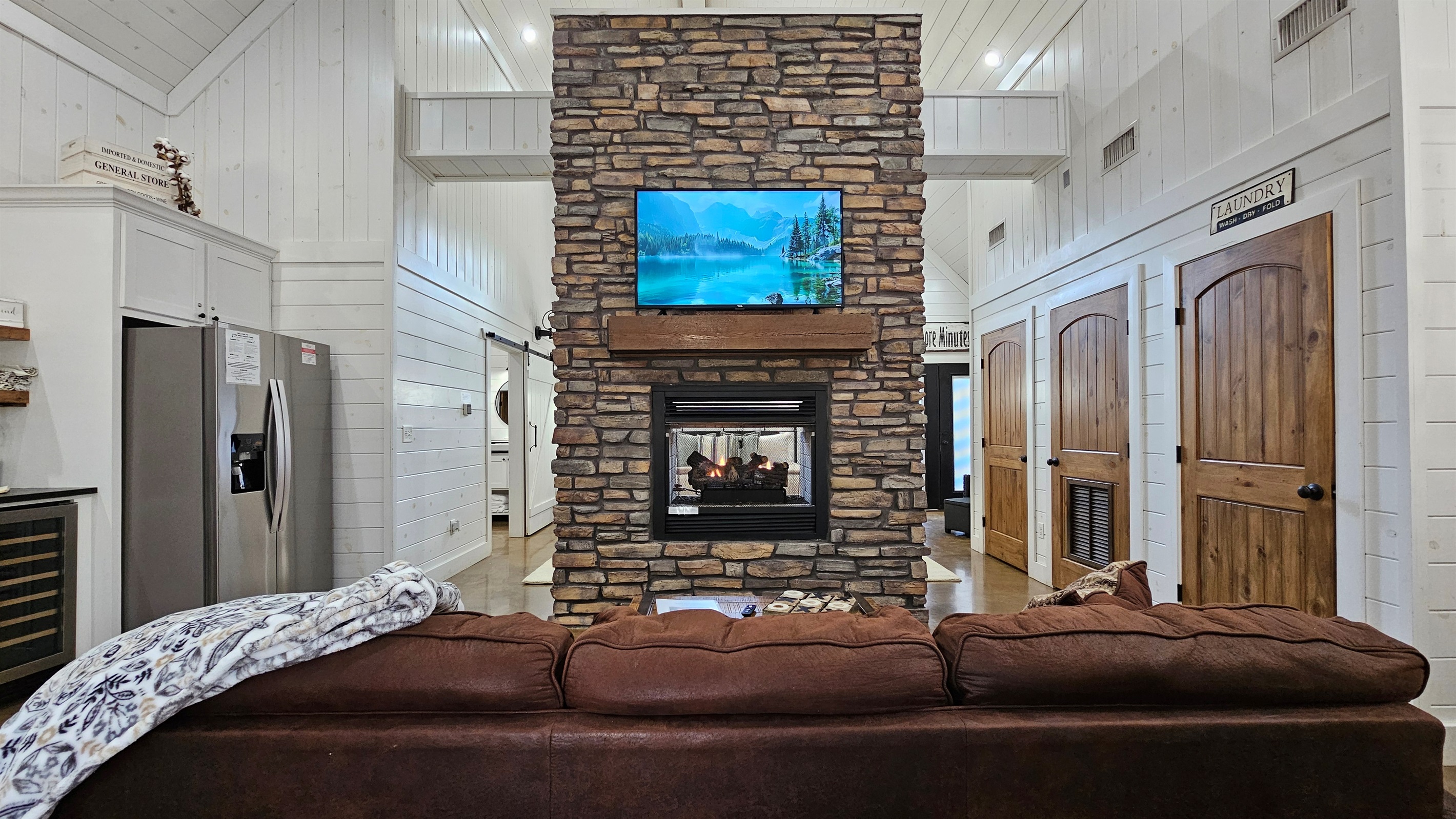 Living Room: Gather around the stunning stone fireplace for game nights and movie marathons!