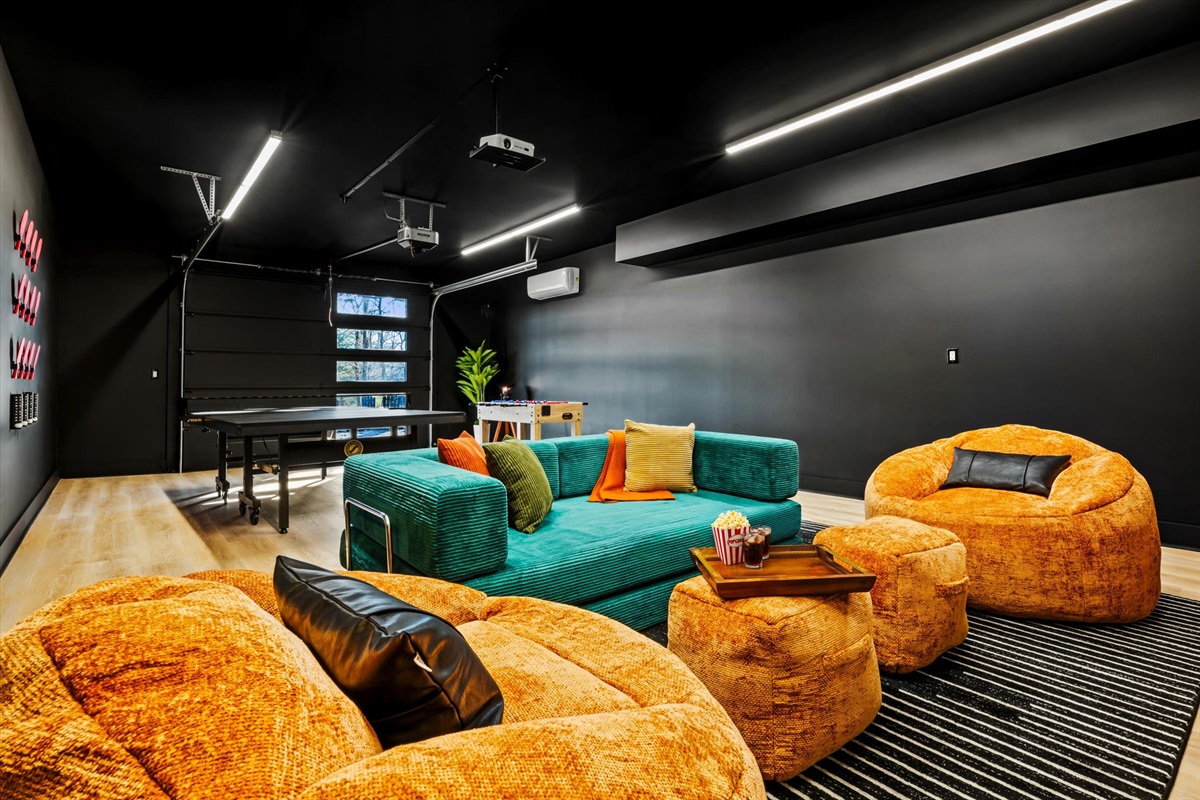 50. {Theater Room}
Dedicated theater room with a 120” projector screen and Roku streaming — sink into plush seating and enjoy movies, shows, or the big game in a true cinematic setting.