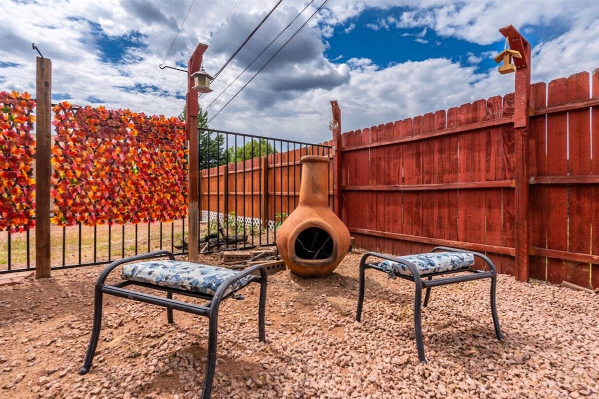 Gather in this inviting backyard, complete with a chiminea for cozy, memorable nights.