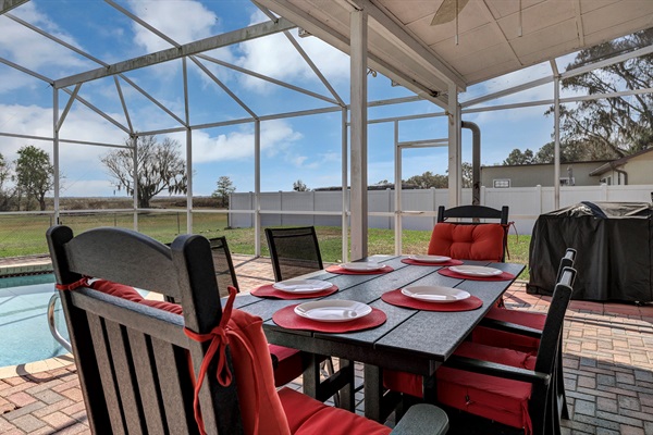 Outdoor poolside dining.  Mini frig and Grilla brand pellet grill make delicious meals