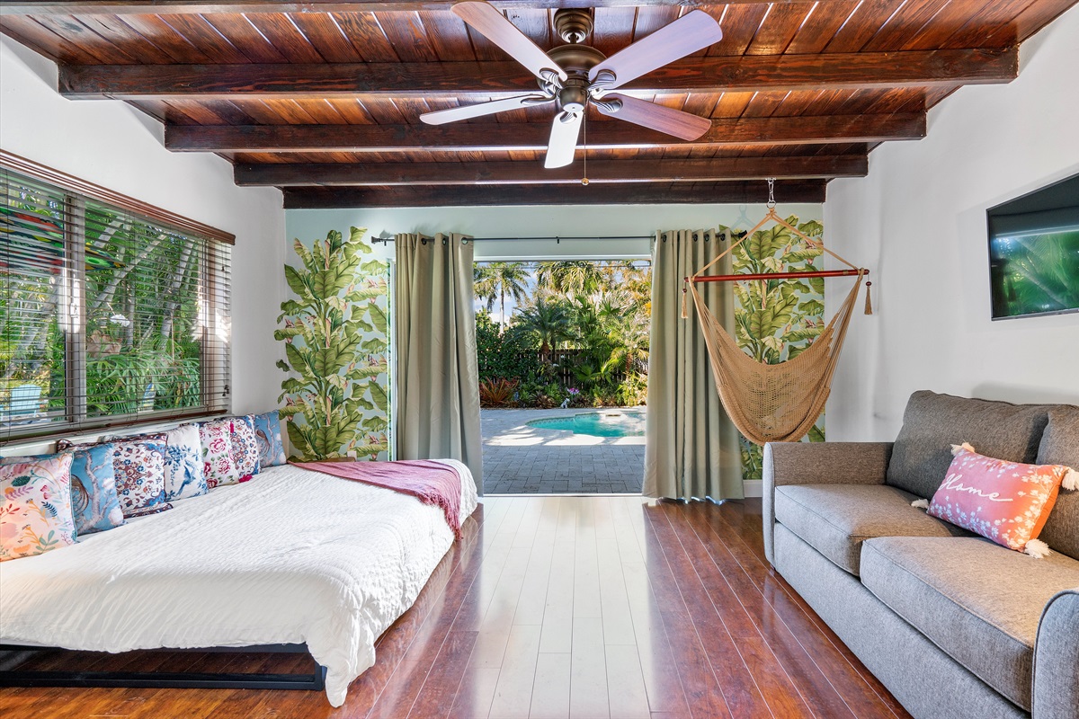 Living area with a bedroom and a view