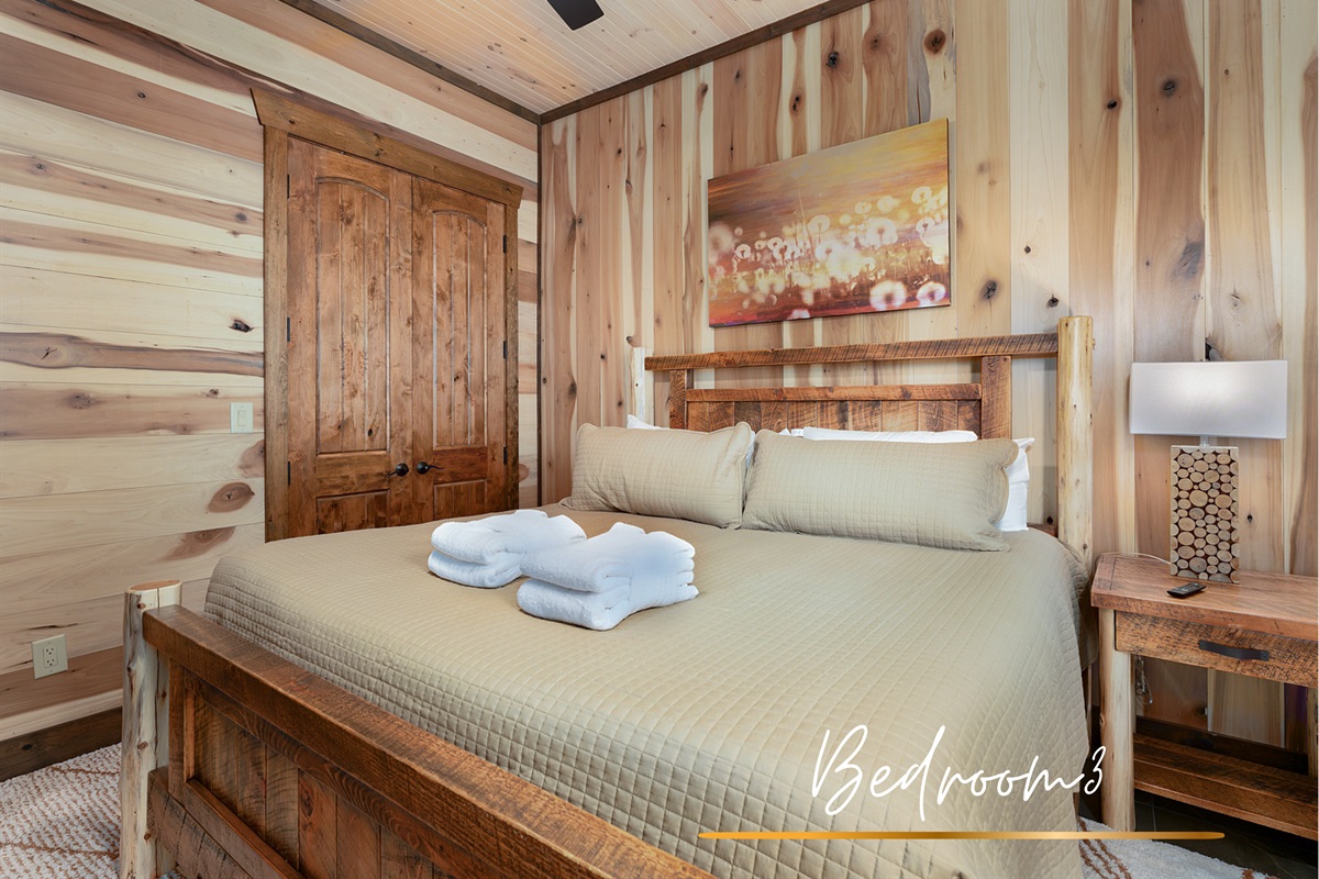 This king bedroom offers a cozy retreat with plenty of natural light and peaceful vibes.