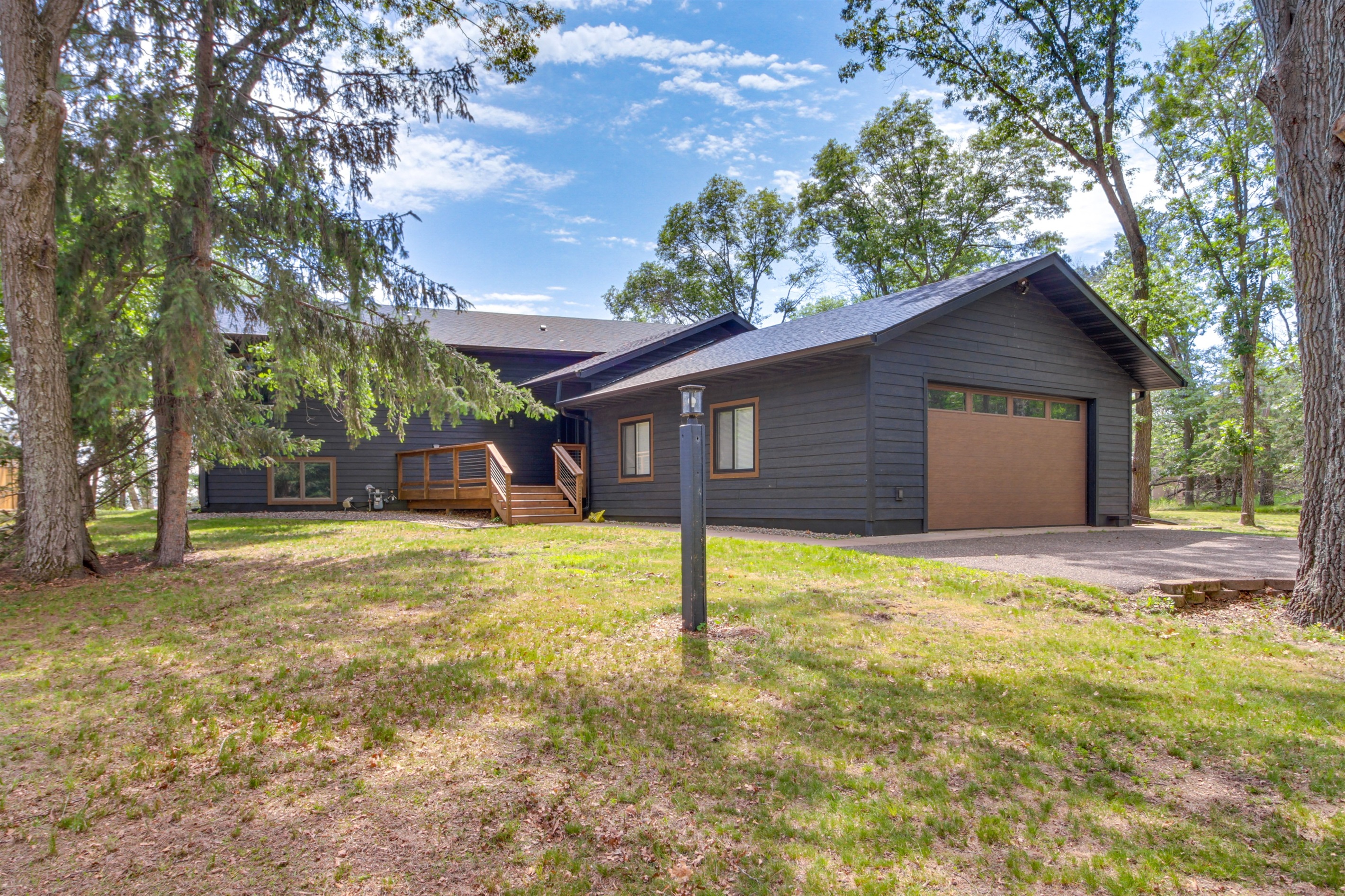 Front exterior and driveway with attached garage and convenient parking