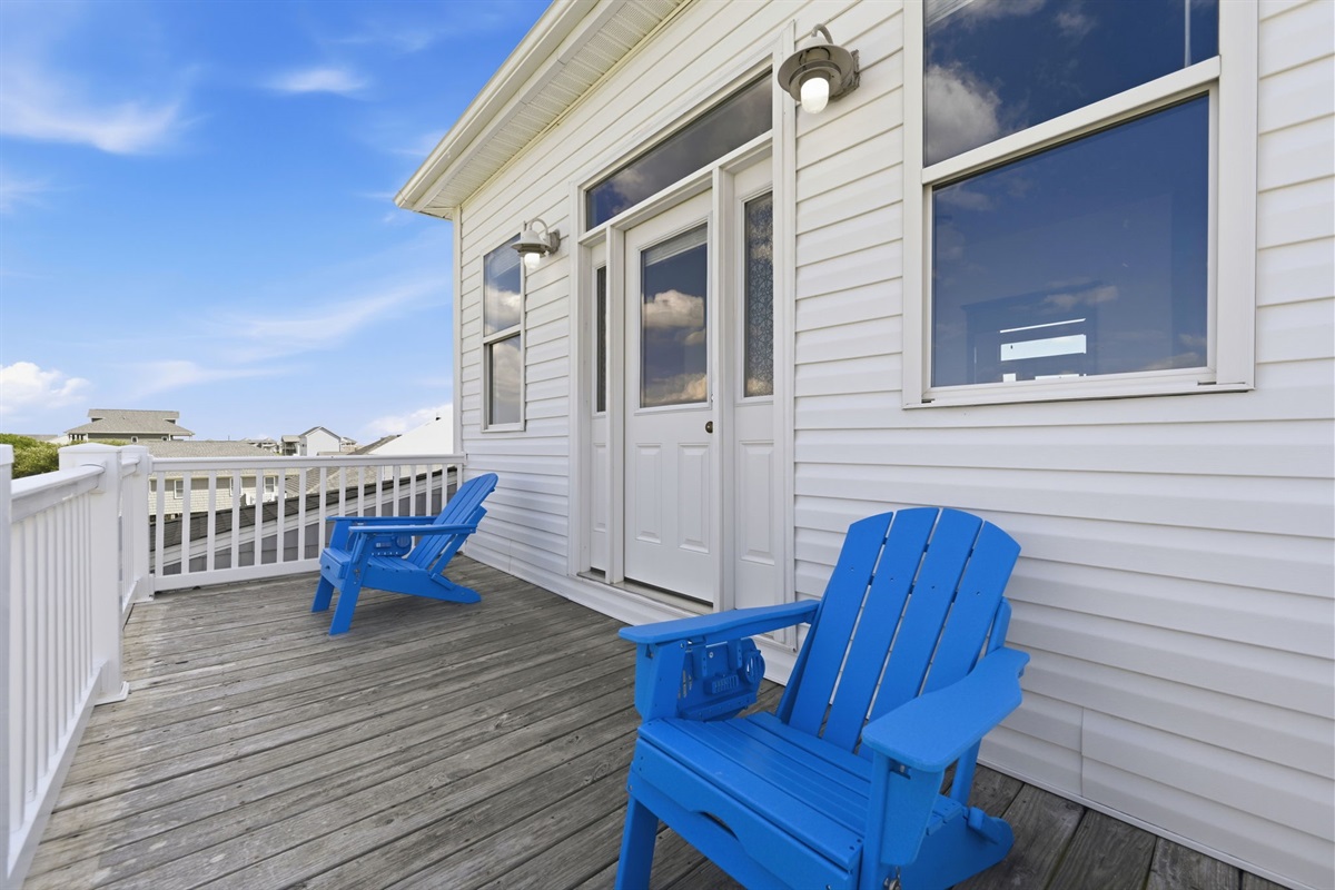 Private master balcony with Adirondack chairs &mdash; the perfect spot for morning coffee or sunset chats