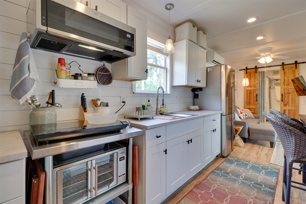 Spacious kitchenette opens to the living room.