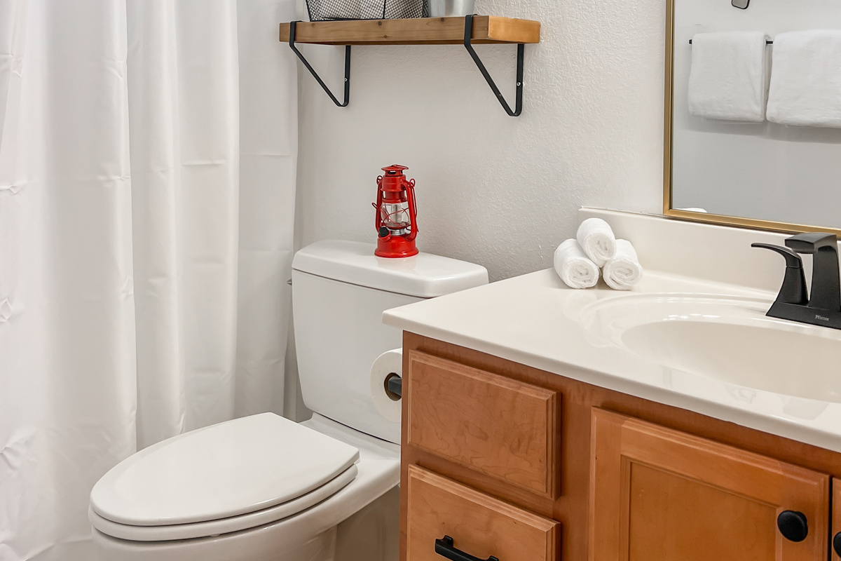 Full bathroom with vanity, toilet and shower, stocked and ready for guests.