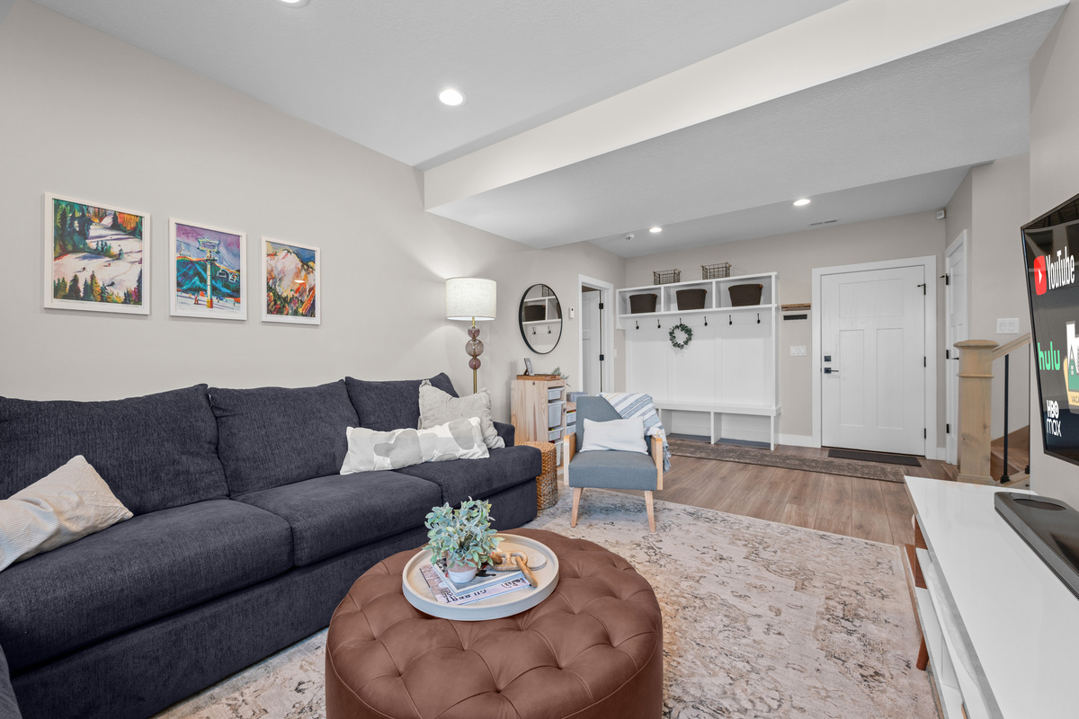 The lower-level recreation room offers a cozy place to relax, play games, or unwind after skiing, hiking, or exploring.
