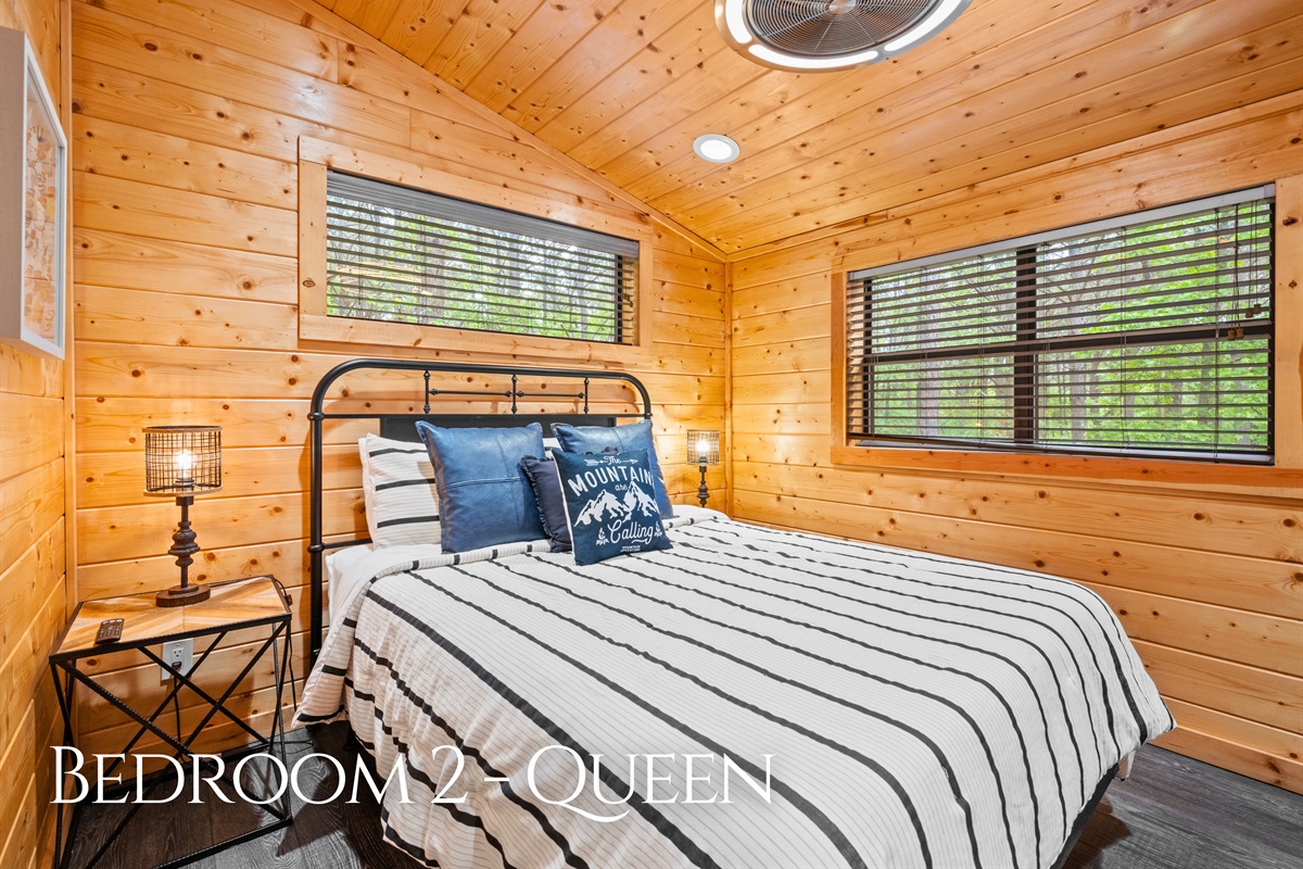 This queen bedroom offers a comfortable and relaxing setup, with just the right amount of space to unwind.