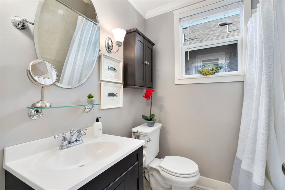 main floor bathroom with shower and tub