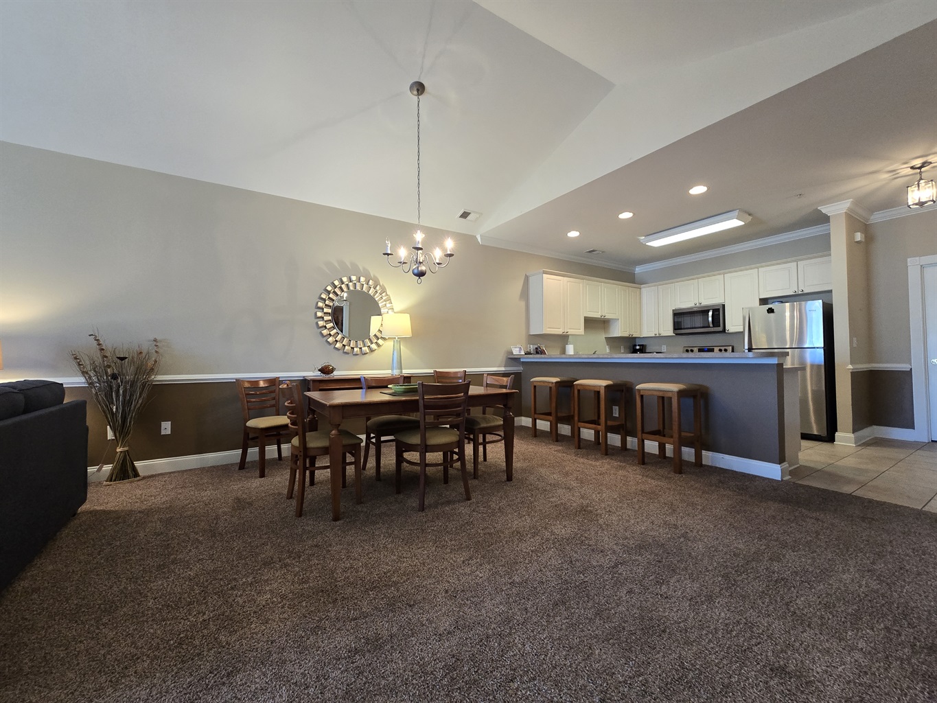 Full Kitchen with Dishwasher, Freezer/Refrigerator, Stove, Microwave, Breakfast Bar.