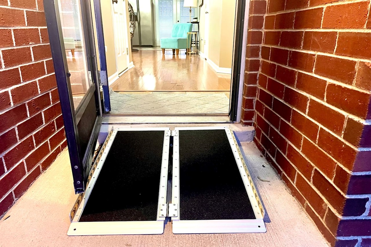 Step-free with portable ramp. This will be folded up in the garage when you arrive. 