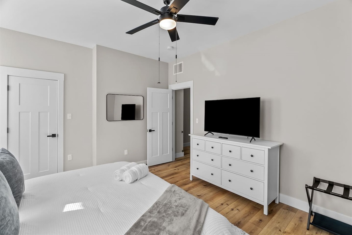 Large room with plush king-size bed and faux fire place. Samsung Smart TV!