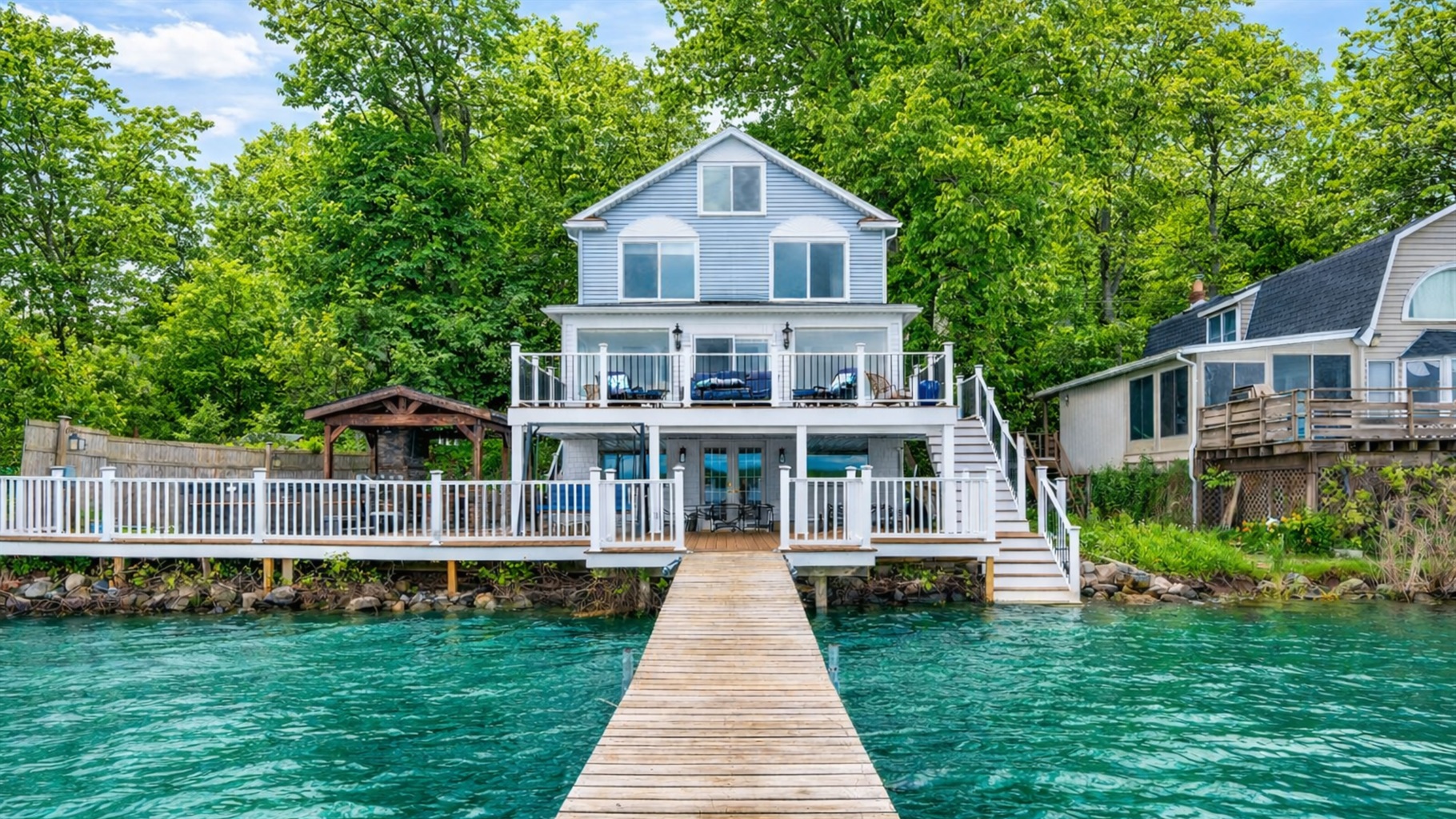 Spacious lakefront home with multi-level decks, perfect for relaxing or entertaining by the water.