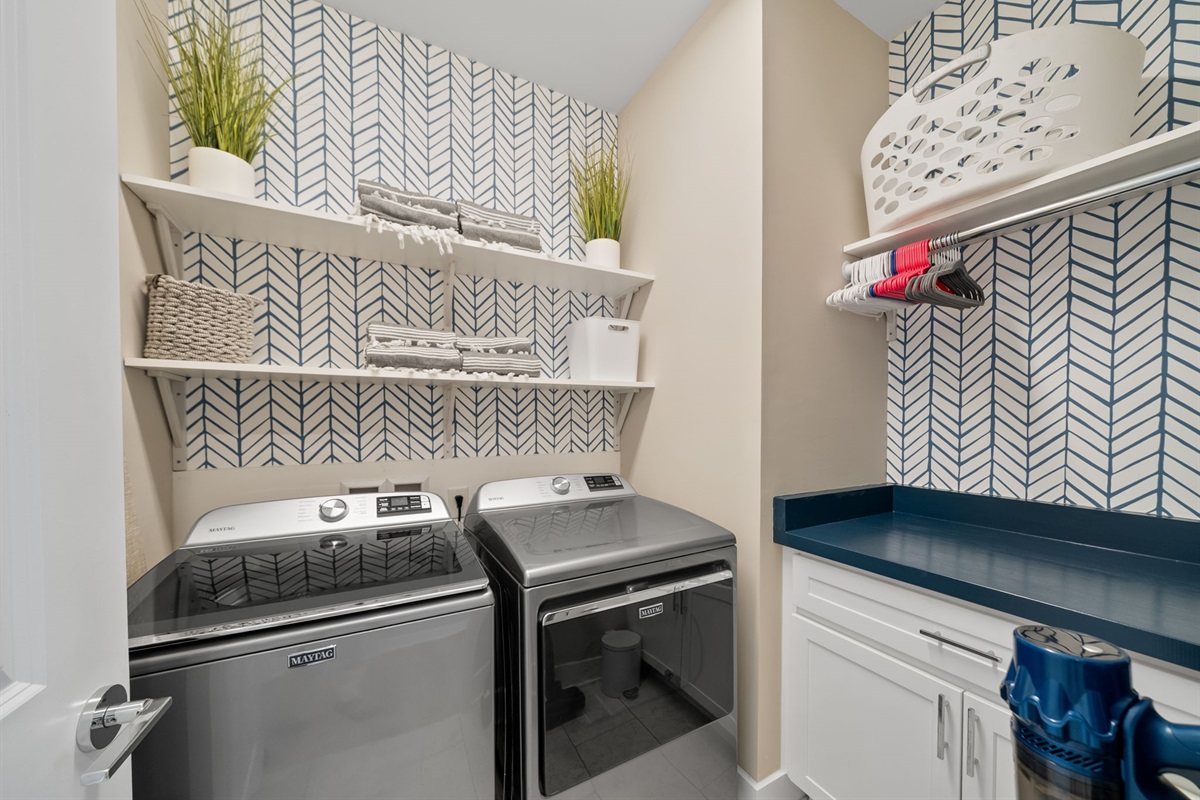 Washer, dryer, iron, ironing board and cordless vacuum.  Beach towels for guest use.