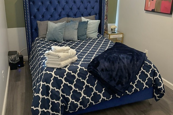 Our second room featuring a queen-size bed, ideal for a peaceful night’s rest.