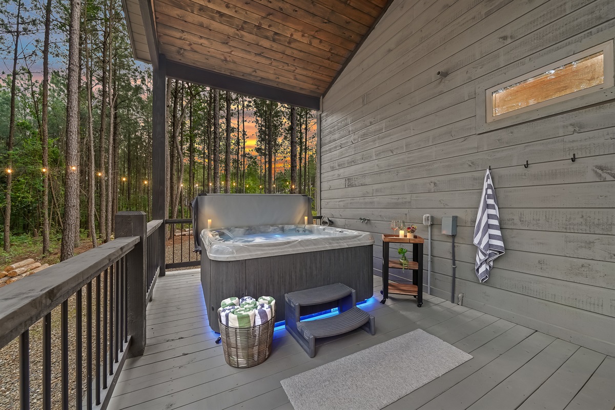 The covered back deck provides everything you need after a fun day in town. Therapeutic hot tub, outside dining table for 6 and more...