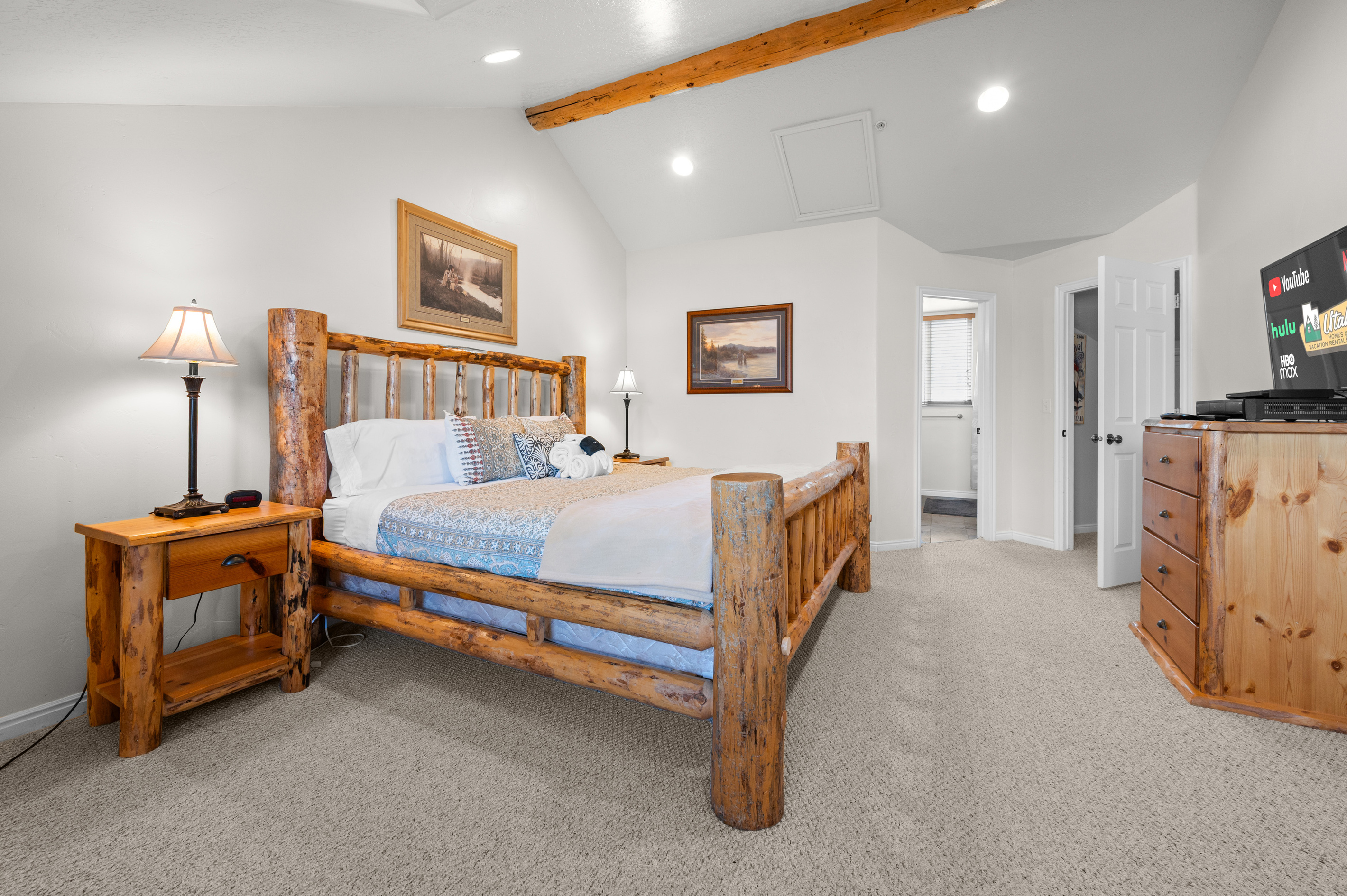 The primary bedroom is outfitted with a king bed, luxurious linens, and plush pillows.