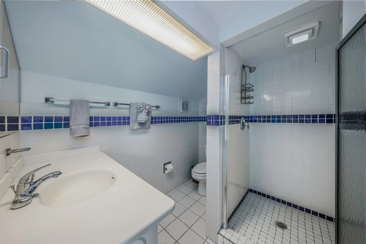 Additional full bathroom featuring modern finishes and convenient space for guests.