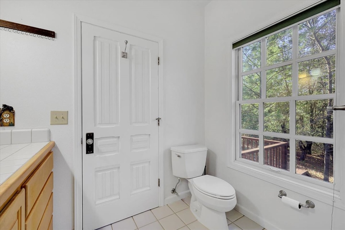 Full Bathroom 1 with a window view, and simple essentials for daily use.

