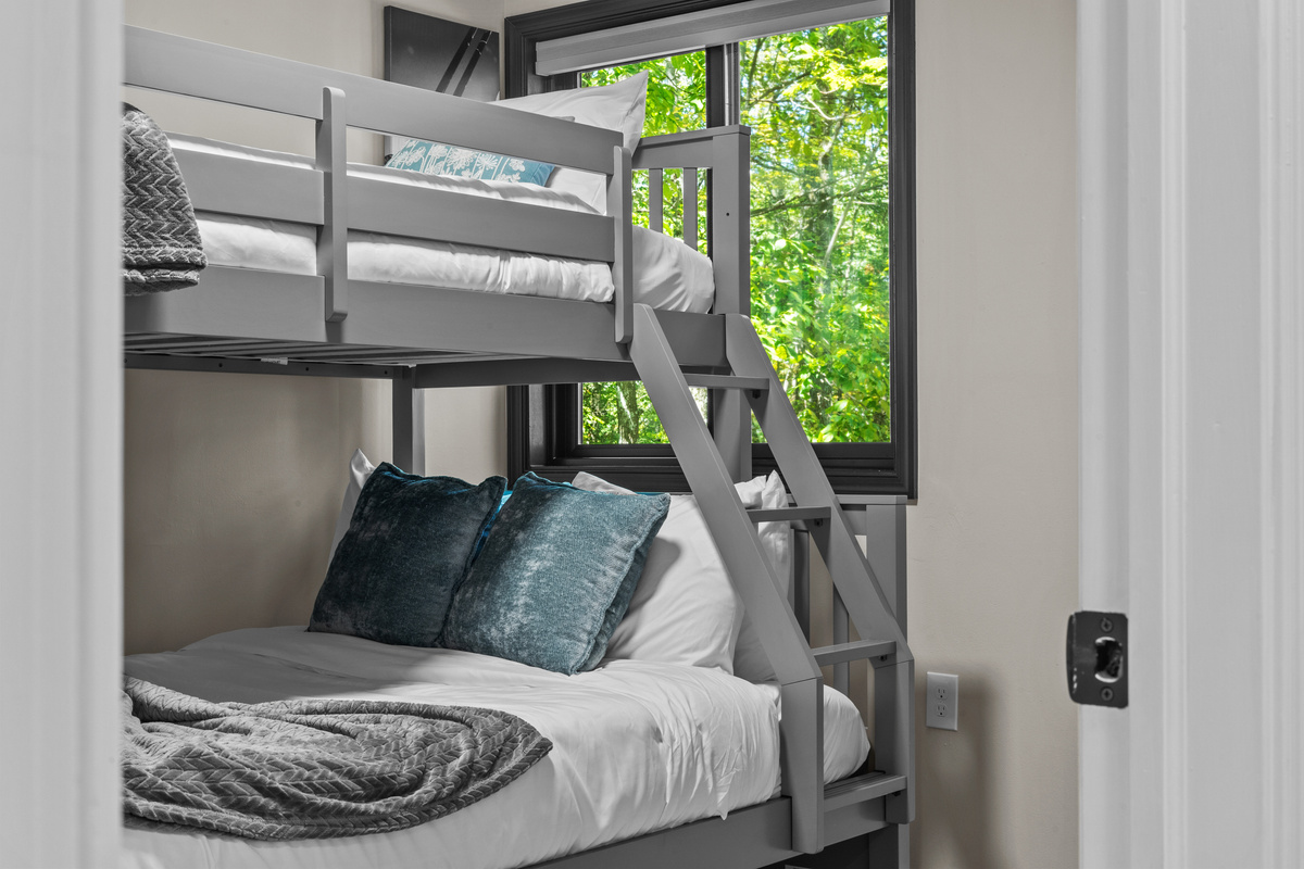 Offering comfortable bedding, featuring crisp linens, plush pillows, and cozy blankets to guarantee a restful night's sleep