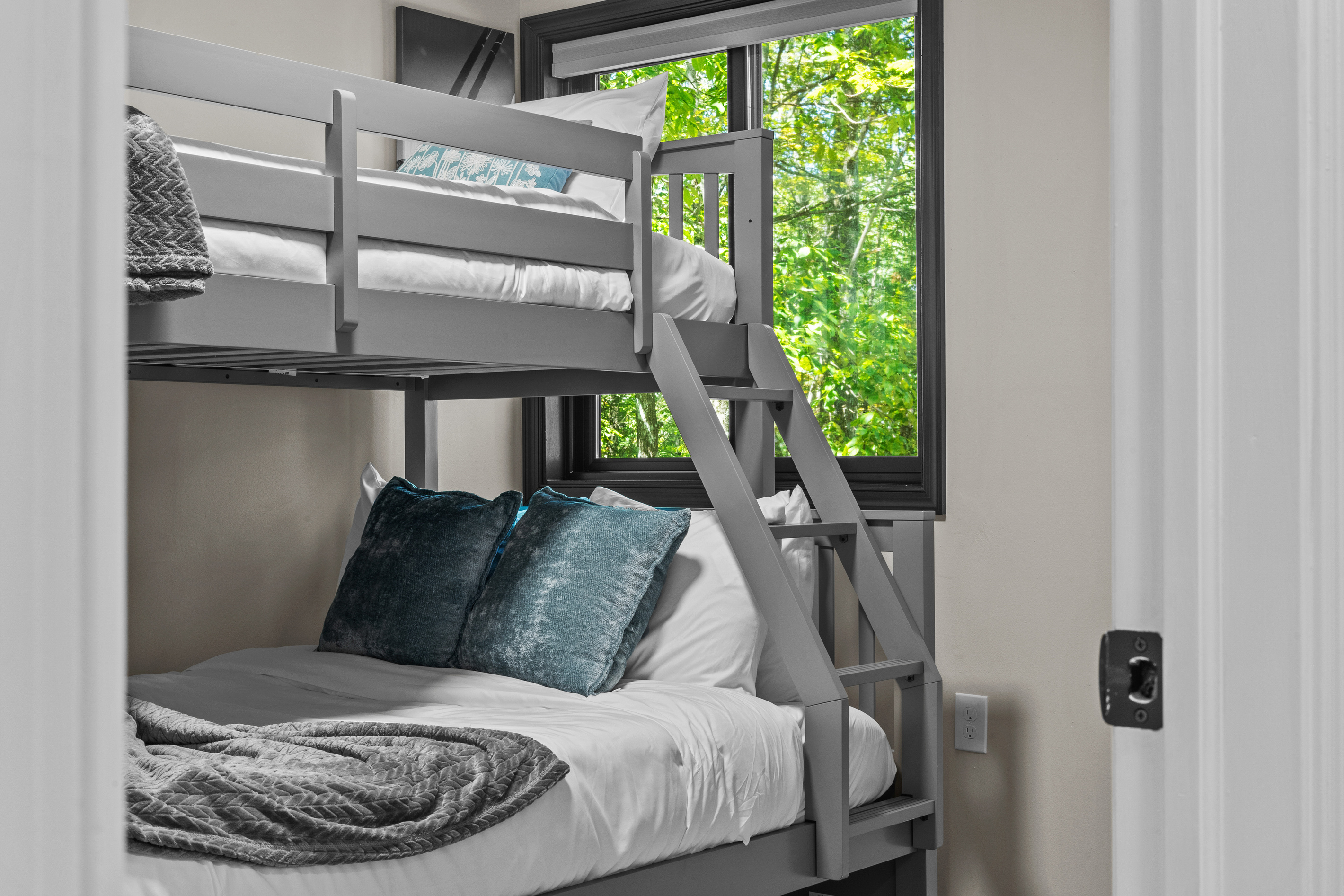 Offering comfortable bedding, featuring crisp linens, plush pillows, and cozy blankets to guarantee a restful night's sleep