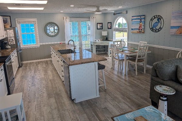 Corner desk in kitchen provides a convenient workstation