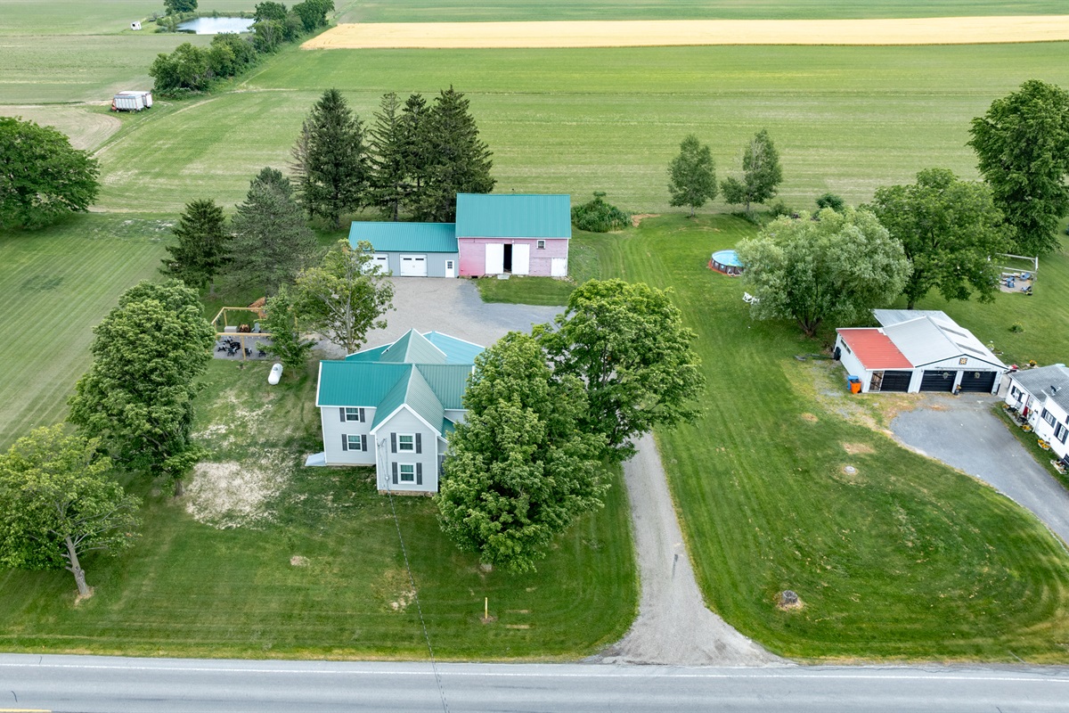Peaceful country living with a charming home, spacious barn, and wide open green space—perfect for outdoor lovers and hobbyists alike.