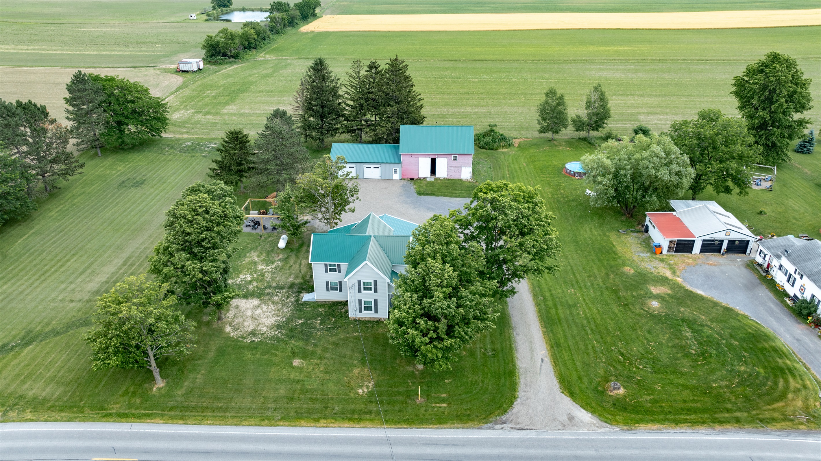 Peaceful country living with a charming home, spacious barn, and wide open green space—perfect for outdoor lovers and hobbyists alike.