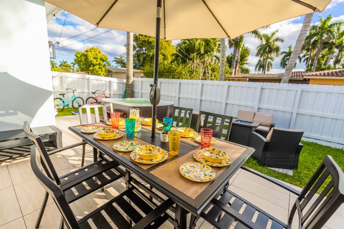 Dine/ BBQ on the patio at the 6 seater dining table and umbrella. Or relax in the new 6 seater hot tub. For those chilly nights, enjoy sitting around the gas powered fire pit lounging areas. The space lit up by remote controlled string lights.