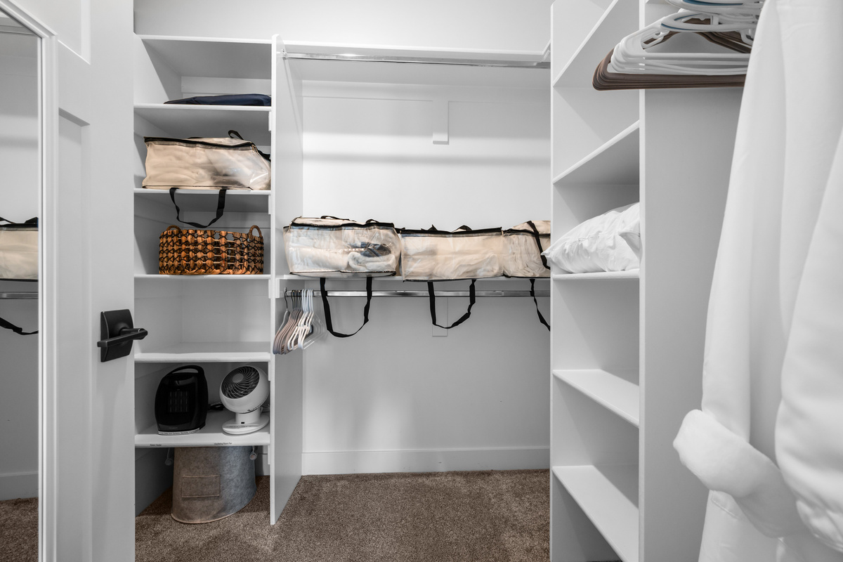 Large walk-in closet provides generous storage for luggage, ski gear, and everything you'll need during your stay.