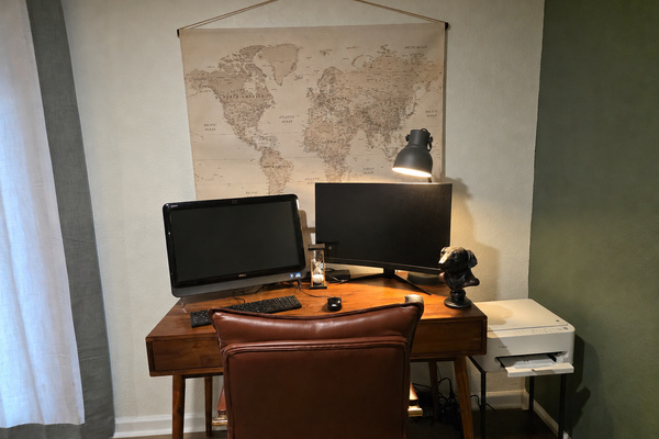 Private workspace in the basement bedroom with a desk, monitor and quiet spot for remote work or planning the day.
