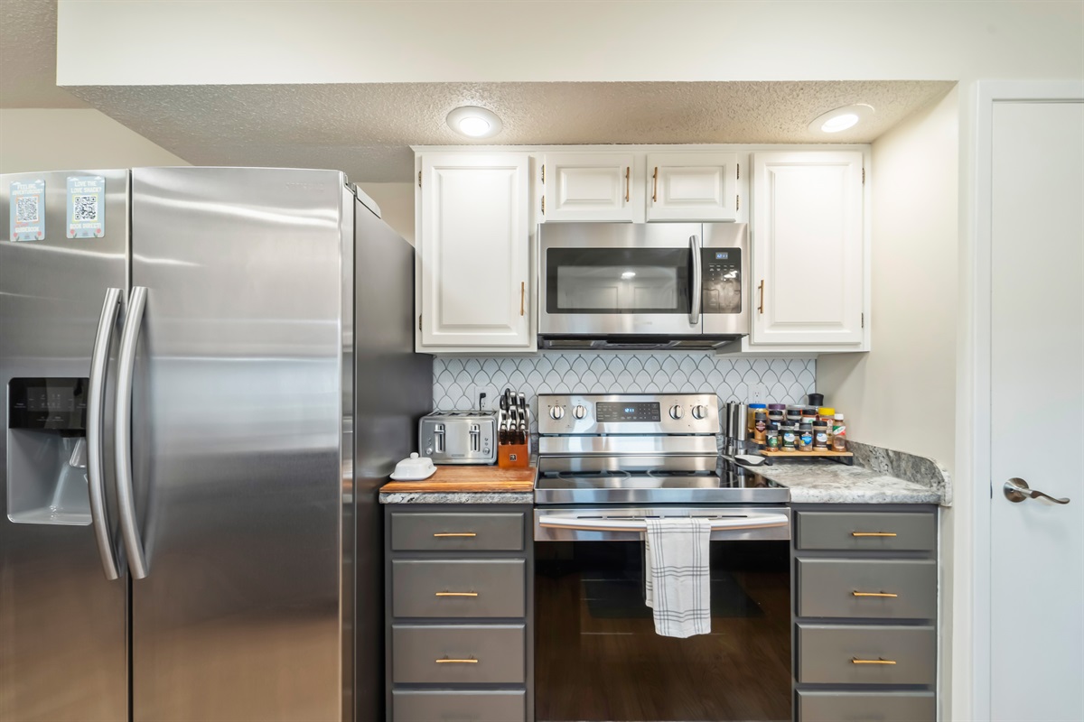 Stainless steel electric appliances with some spices, herbs, and cooking oils to get you started.