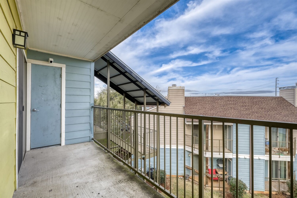 Open-air balcony with peaceful views and plenty of natural light — a perfect spot to unwind.