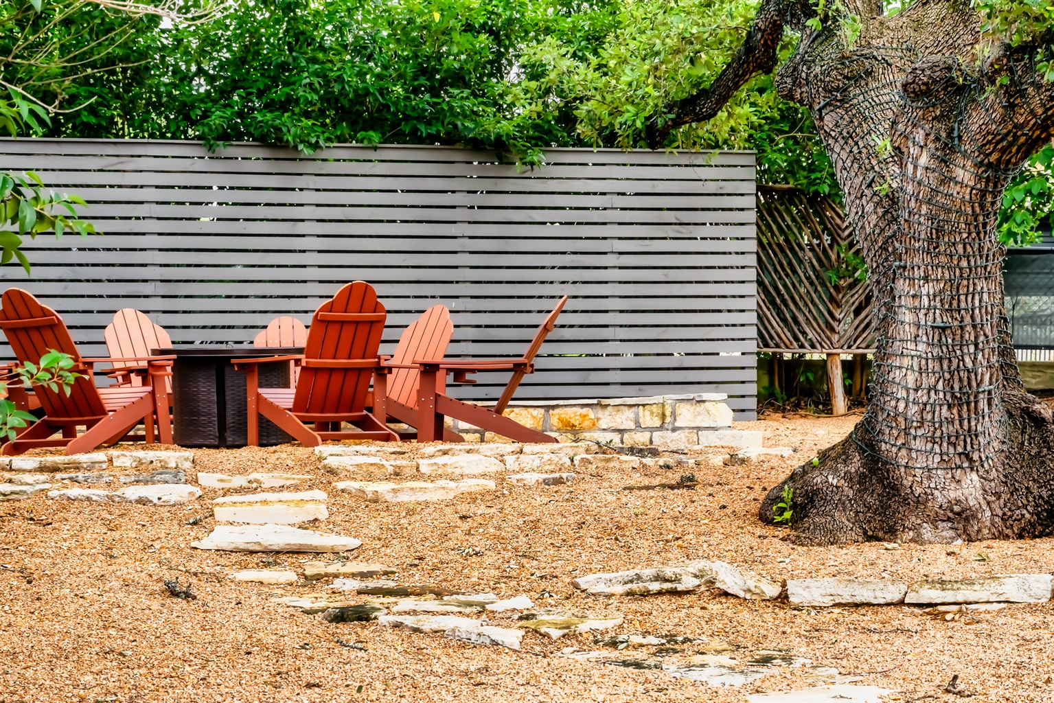 Intimate fire-pit with a quaint walking path to the house.