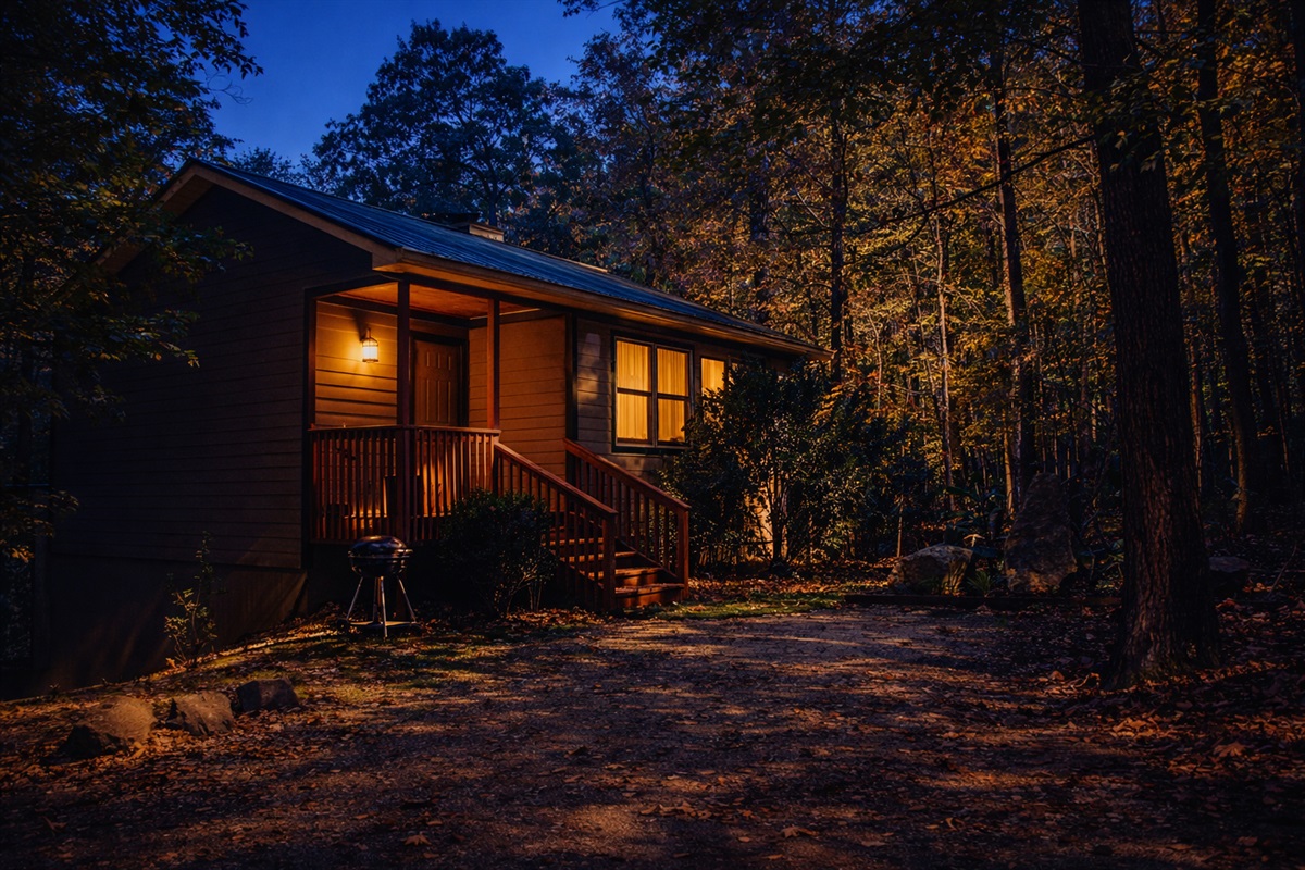 Glowing lights, quiet woods, and cozy nights await.