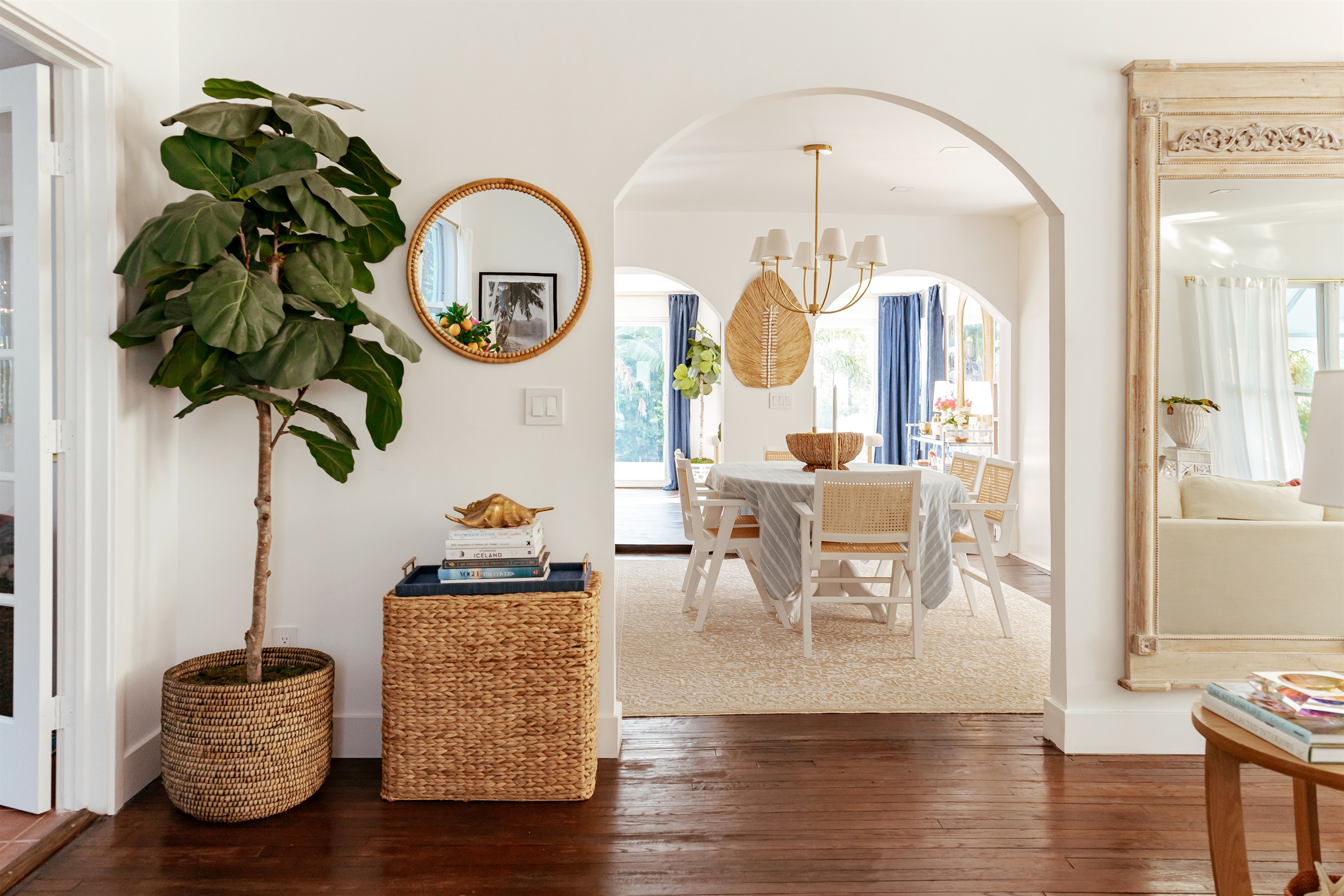 A view from the parlor to the dining area, showcasing a flowing design and capturing natural light.