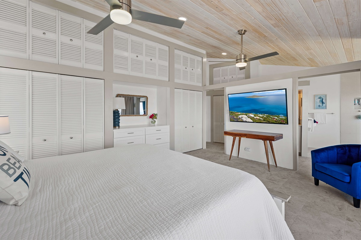 Primary bedroom with king bed and Smart TV