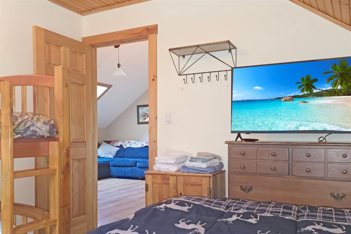 The third bedroom on the second floor of the main home offers plenty of clothing storage and a TV for the family on your stay! 