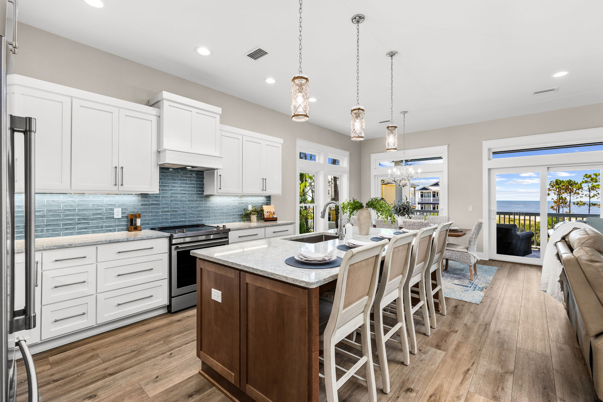 The fully equipped kitchen and oversized island make it easy to cook, gather, and create lasting vacation memories together.