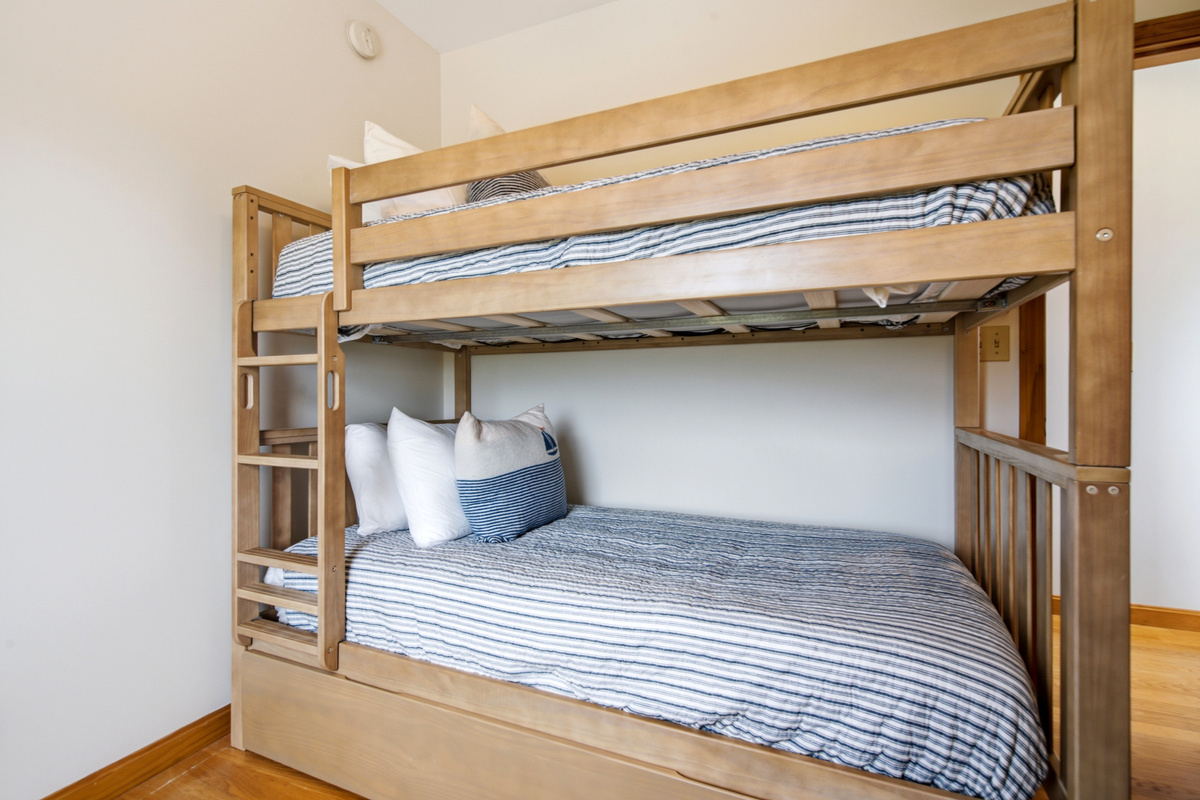 Built-in twin-over-full bunk bed with comfortable mattresses and sturdy construction.