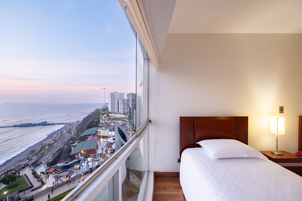 Coastal Sunset View: Even from our third bedroom, guests can enjoy the magical glow of the Peruvian sunset over the ocean, creating a warm and relaxing ambiance