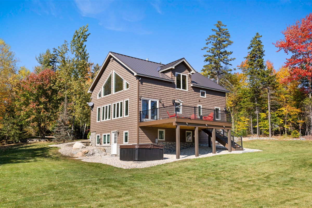 Back of house with hot tub