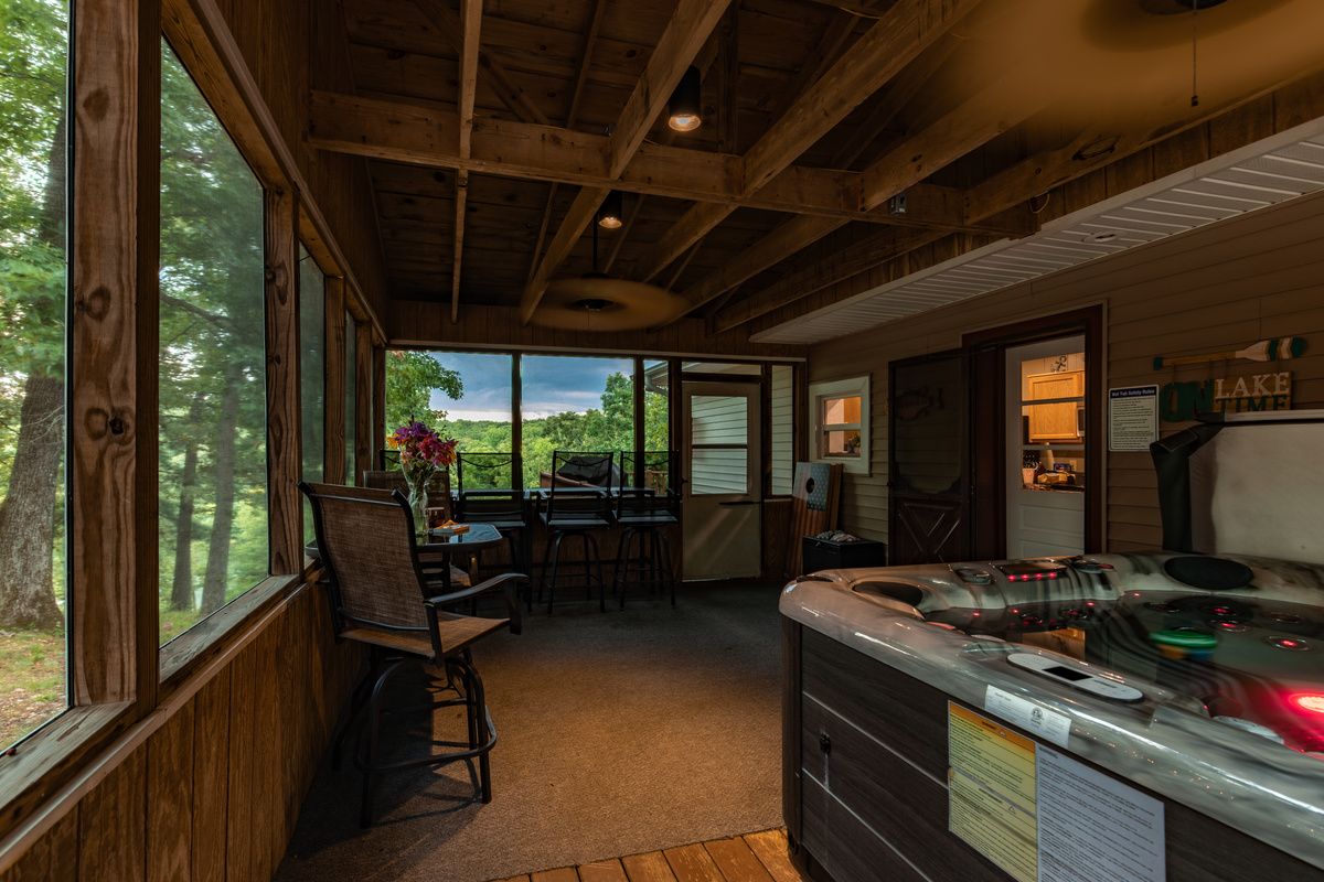 Rain or shine, the screened porch gives the family room to dine, relax, and enjoy the hot tub together.