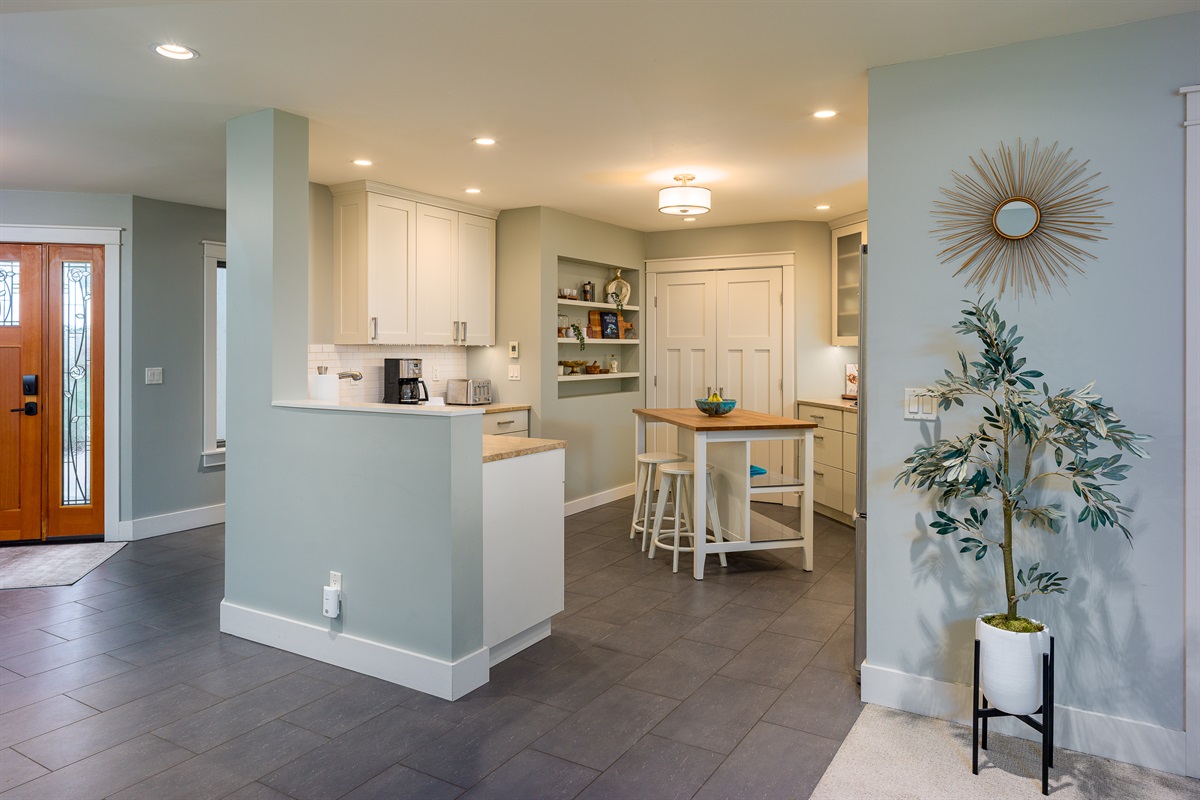 Open flow between kitchen and family room offers easy family connection, communication and gathering.