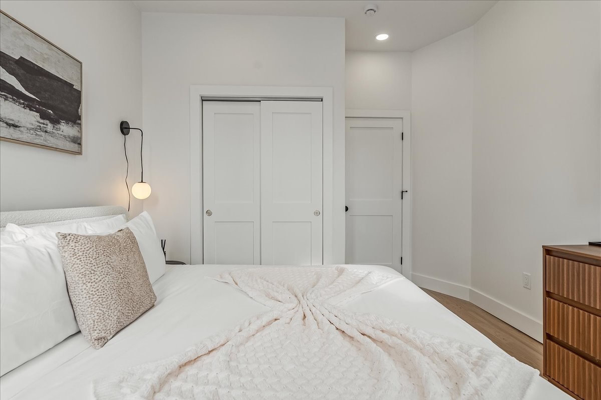 Spacious bedroom with king-size beds and TVs.