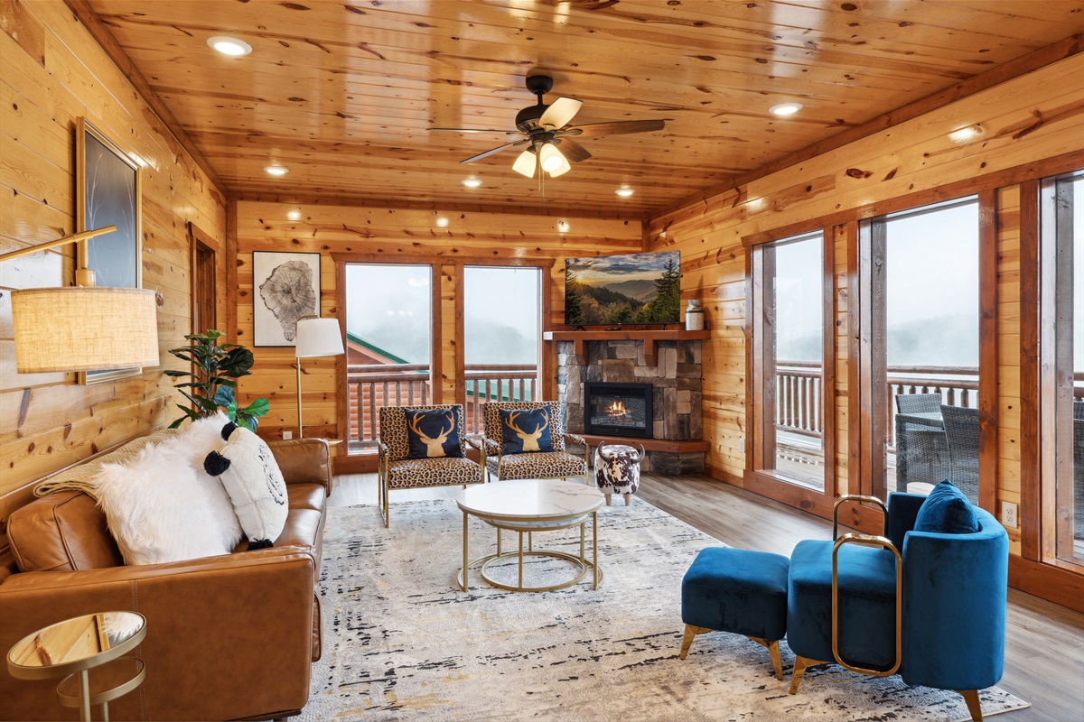 Main level living area featuring a fireplace and TV